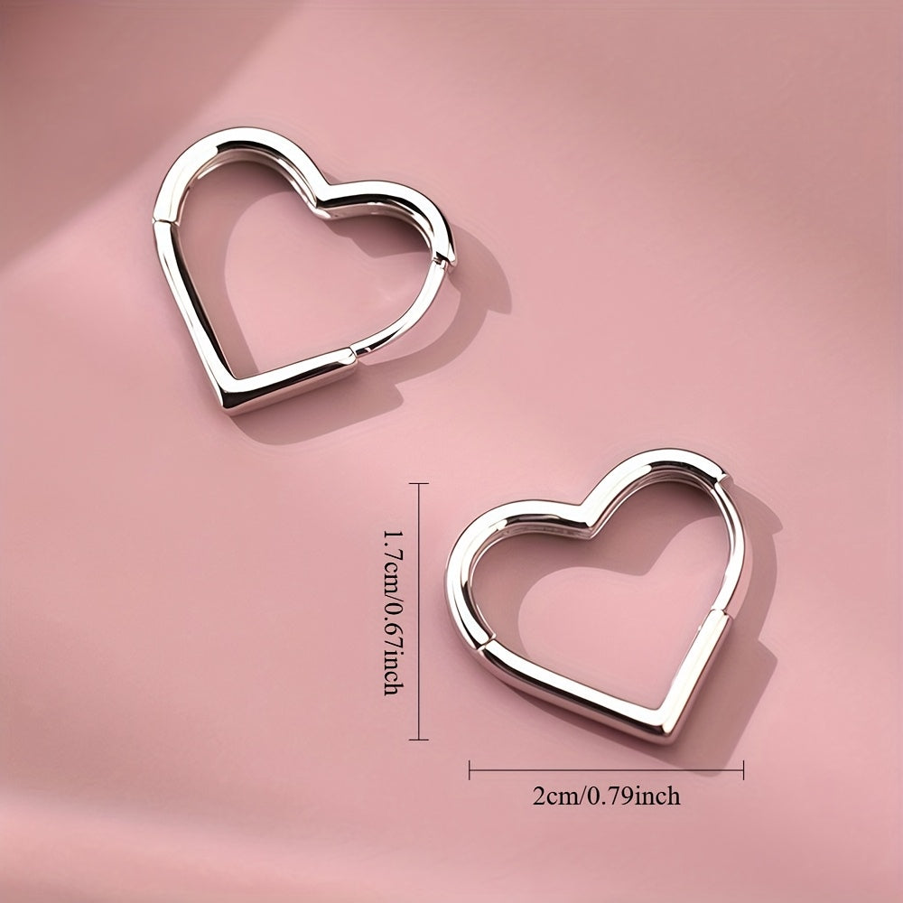Orecchini in acciaio inox a cuore dorato