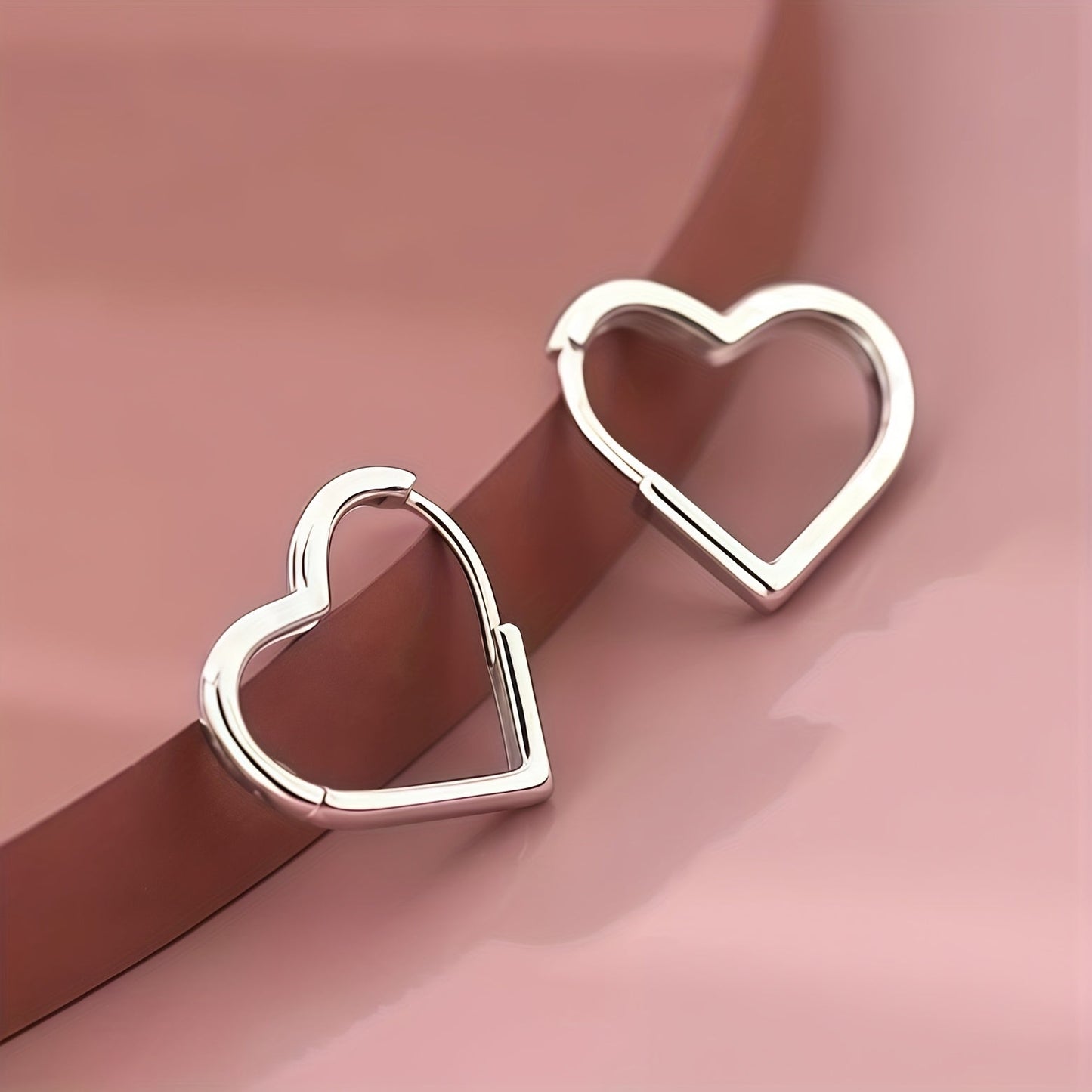 Orecchini in acciaio inox a cuore dorato