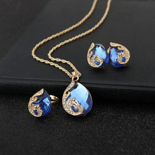 Set di collana e orecchini in cristallo blu con montatura in oro