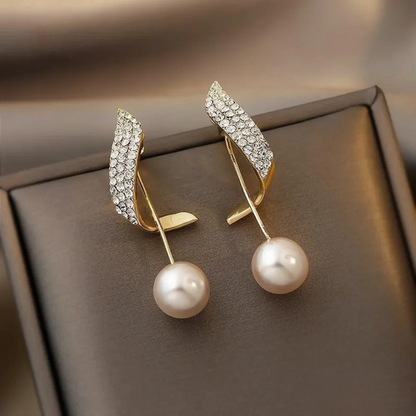 Orecchini pendenti chic in oro con perla