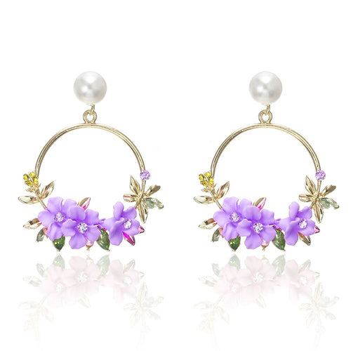 Orecchini eleganti in oro con fiore e perla