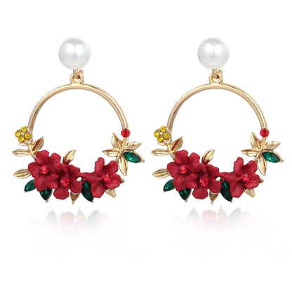 Orecchini eleganti in oro con fiore e perla