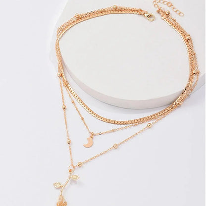 Set di collane con ciondolo a rosa dorata